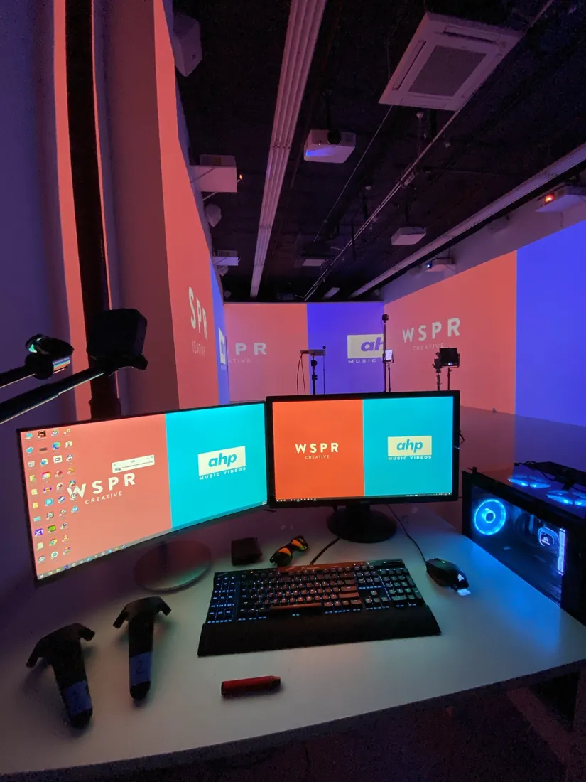 The editing desk in the AHP studio, with the AHP and WSPR logos on its screens.